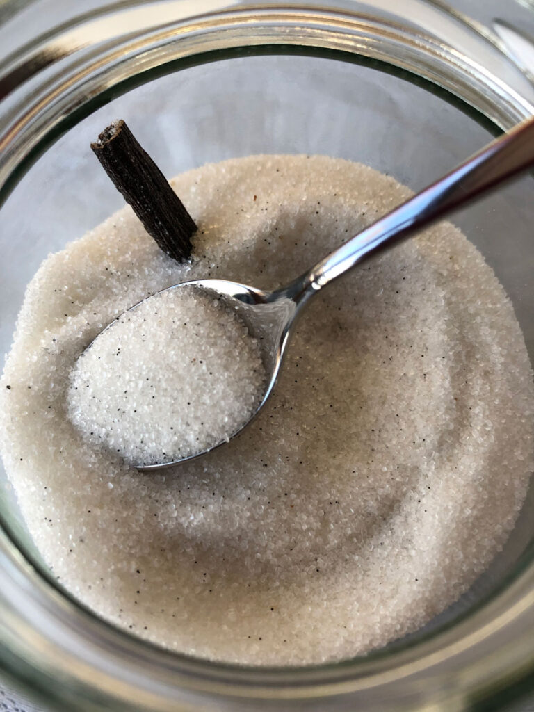 Homemade vanilla sugar in an open jar