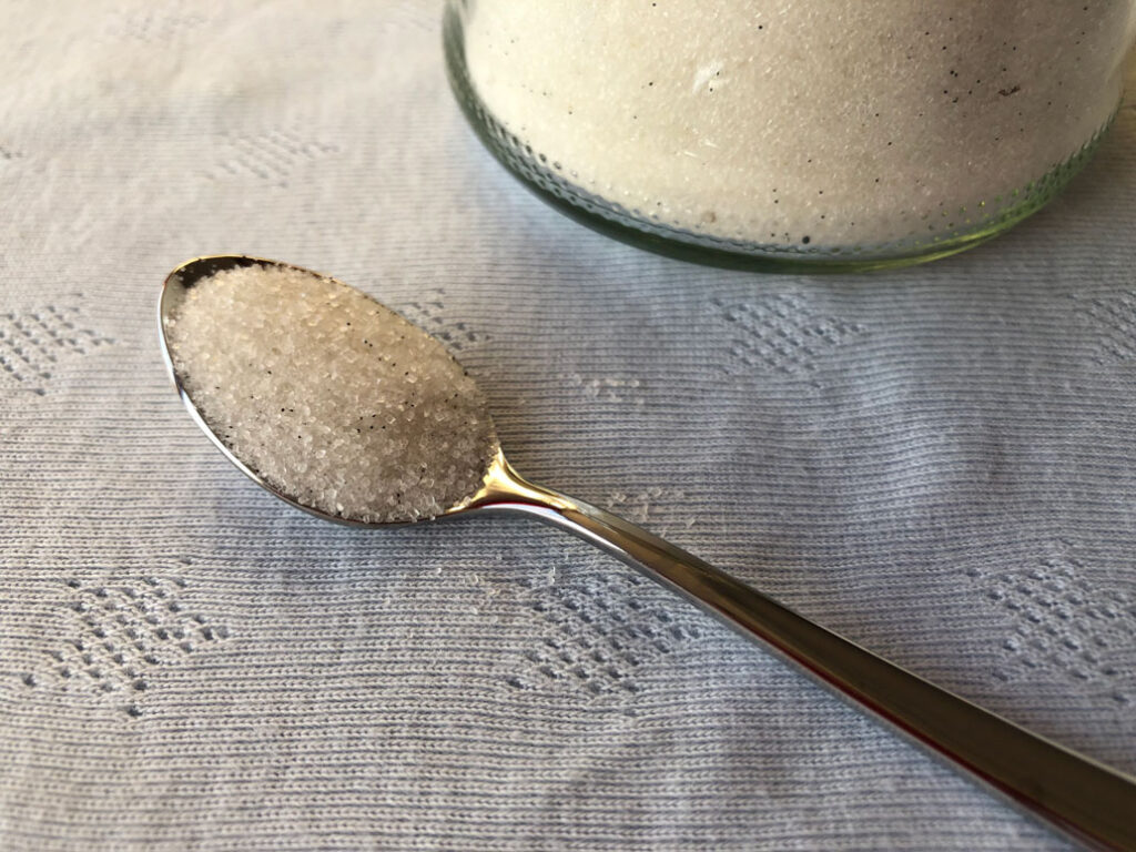 Homemade vanilla sugar on a spoon