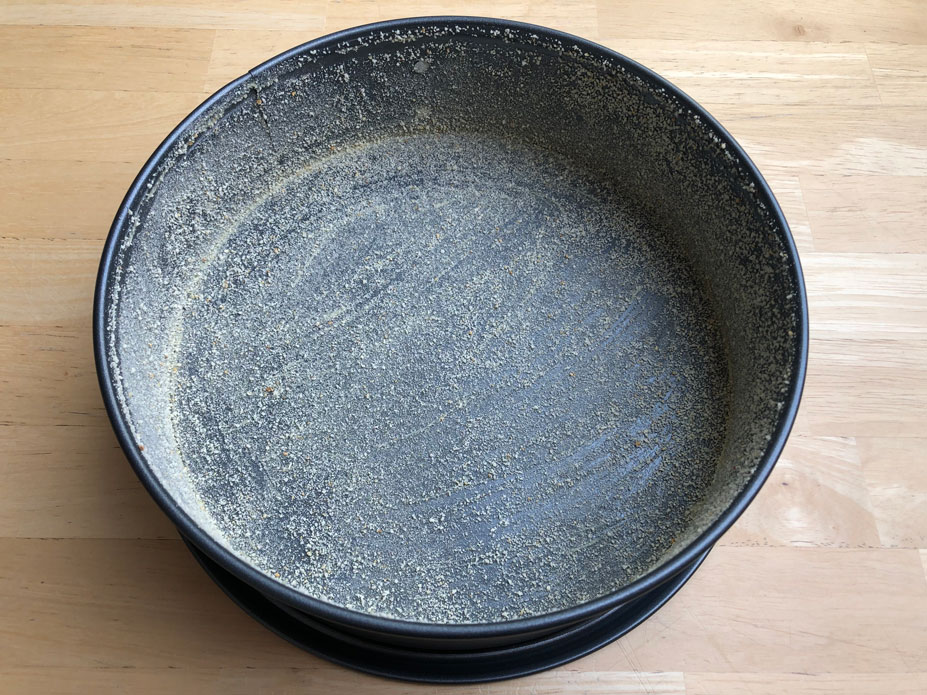 Greased and sprinkled 9-in springform pan for making a Swedish sticky mint chocolate cake.
