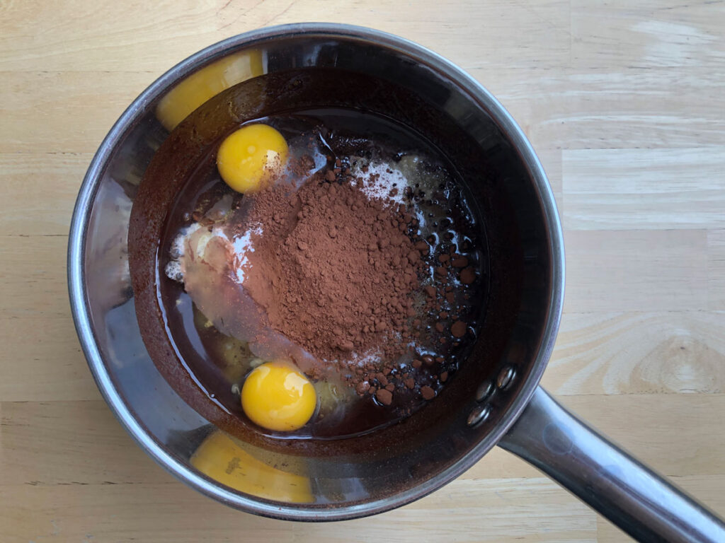 Ingredients for Swedish sticky mint chocolate cake in a medium saucepan.