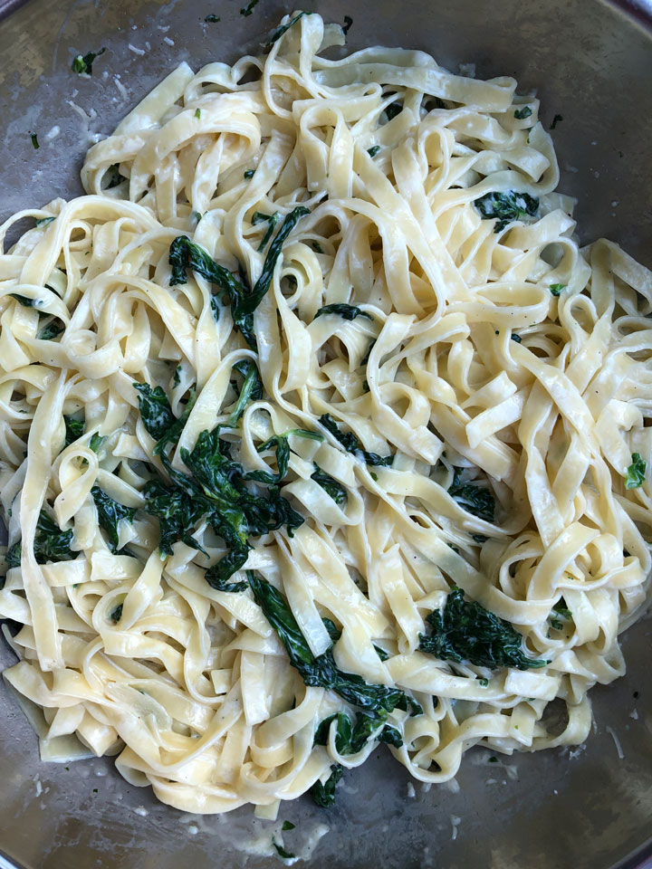 Spinach and mascarpone pasta in a large skillet.