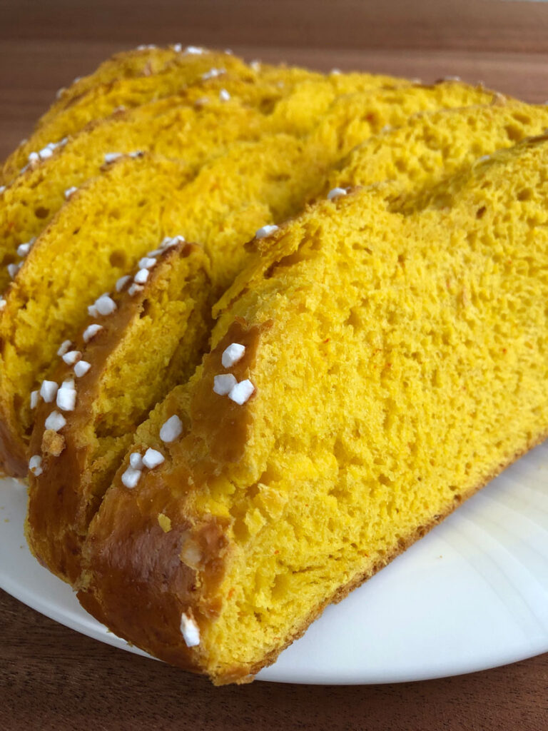 Pumpkin bread slices on a plate.