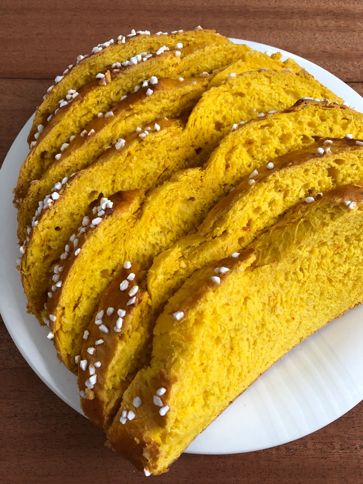 Pumpkin bread slices on a large plate.