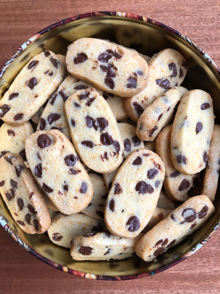 Chocolate chip orange slice and bake cookies in a metal tin.
