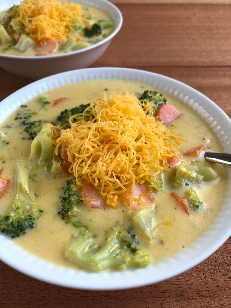 Broccoli cheese soup served in bowls.