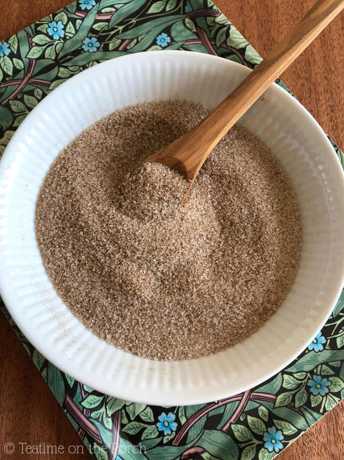 Homemade cinnamon sugar in a small bowl on a tray.