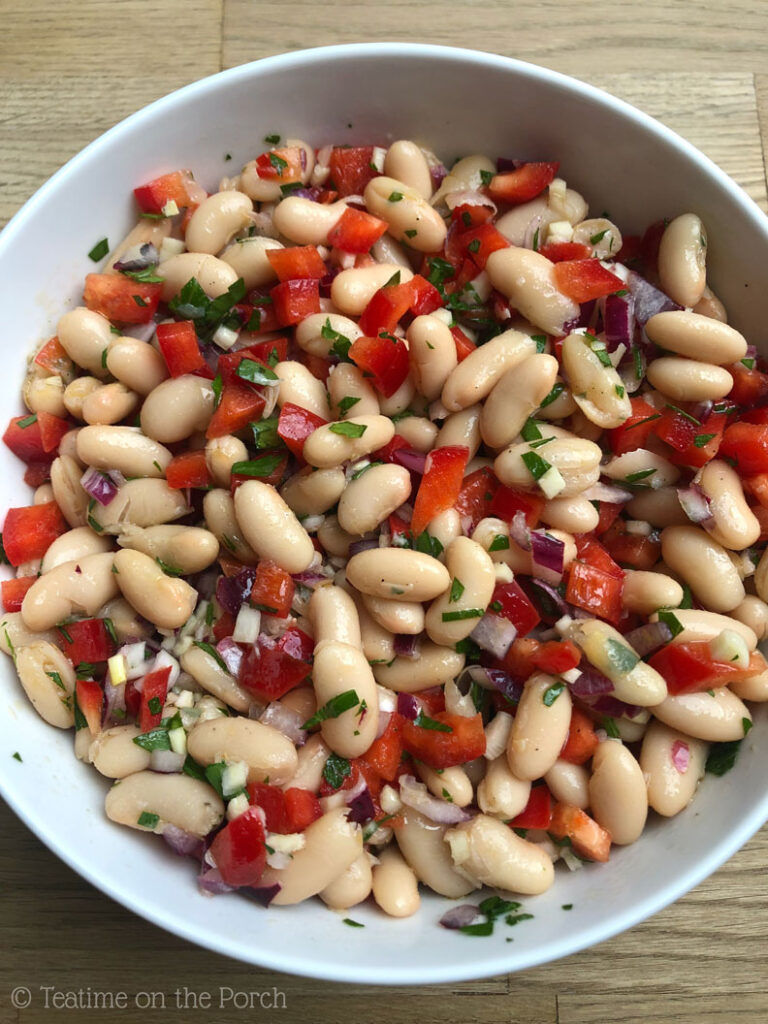 White bean salad in a large serving bowl.