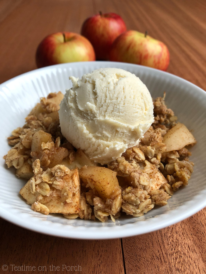 Healthy Apple Crisp Healthy apple crisp served in a bowl with a scoop of vanilla ice cream on top.