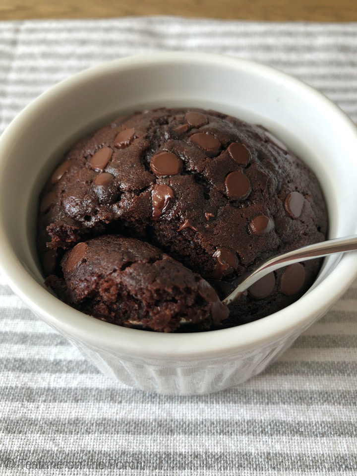 Chocolate mug cake in a ramekin, with a spoon in it.